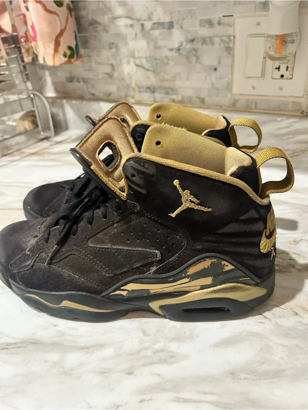 Jordan Black and Metallic Gold High-Top Sneakers